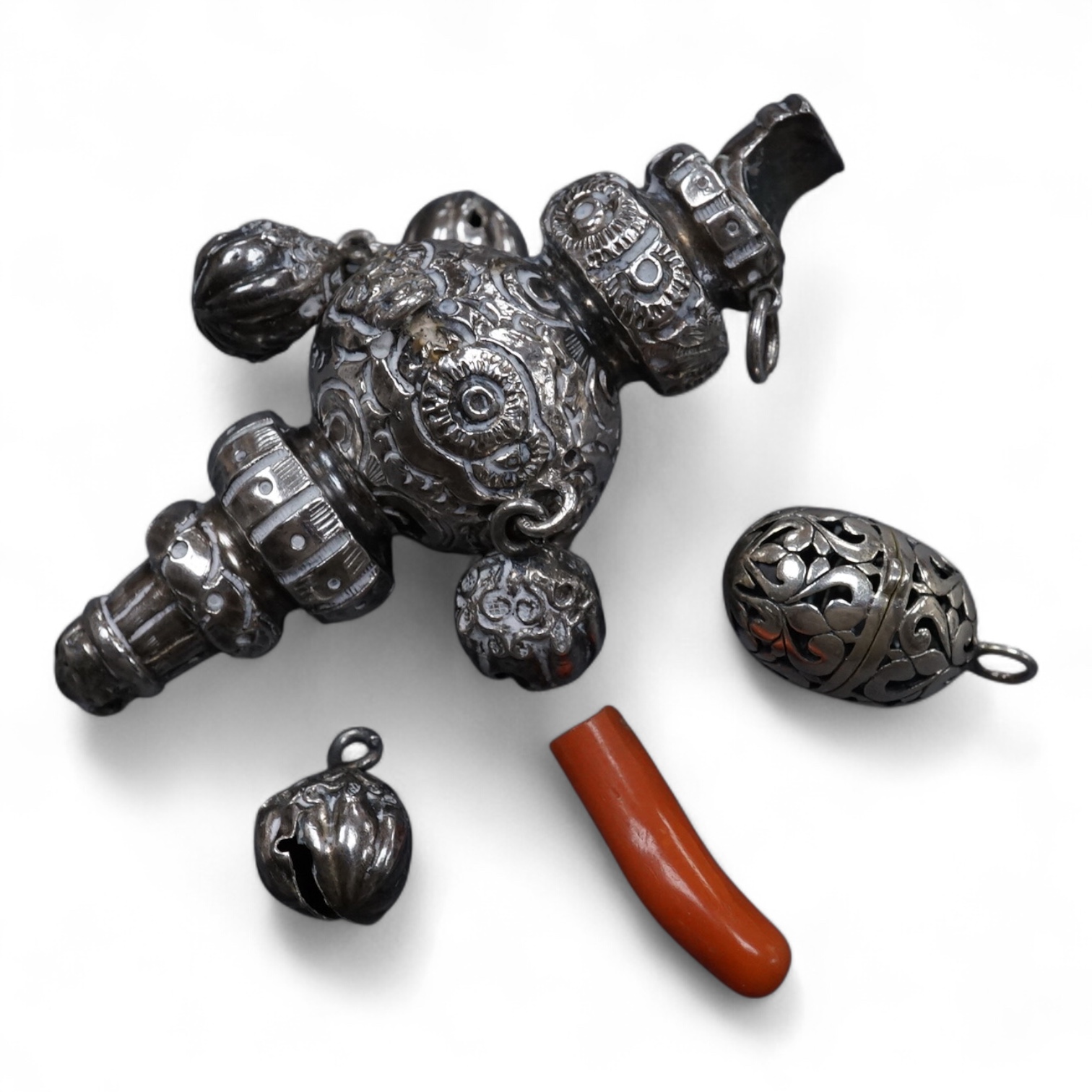 A late Victorian silver child's rattle, with four (ex five) bells and damaged coral teether, Colen Hewer, Cheshire, Birmingham, 1890, 78mm without the coral.